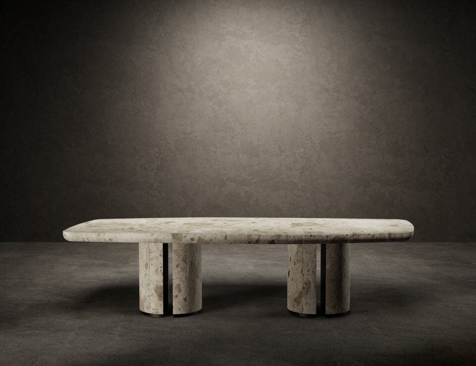 Rectangular marble dining table with rounded edges and cylindrical legs