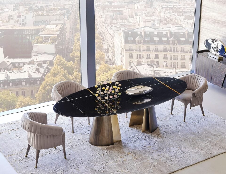 Absolute marble dining table with Sahara Noir finish in dining room setting