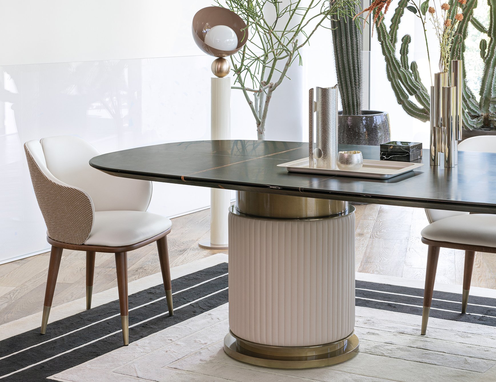 Leather dining chair with wooden legs beside a dining table