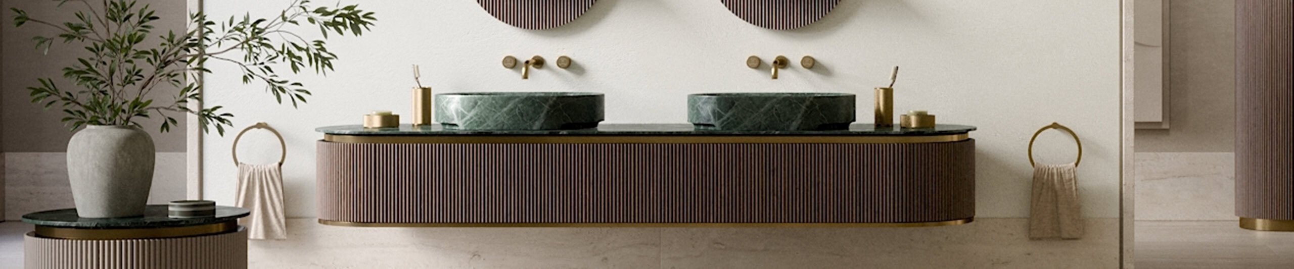 Double bathroom vanity with green marble basins and wood cabinet