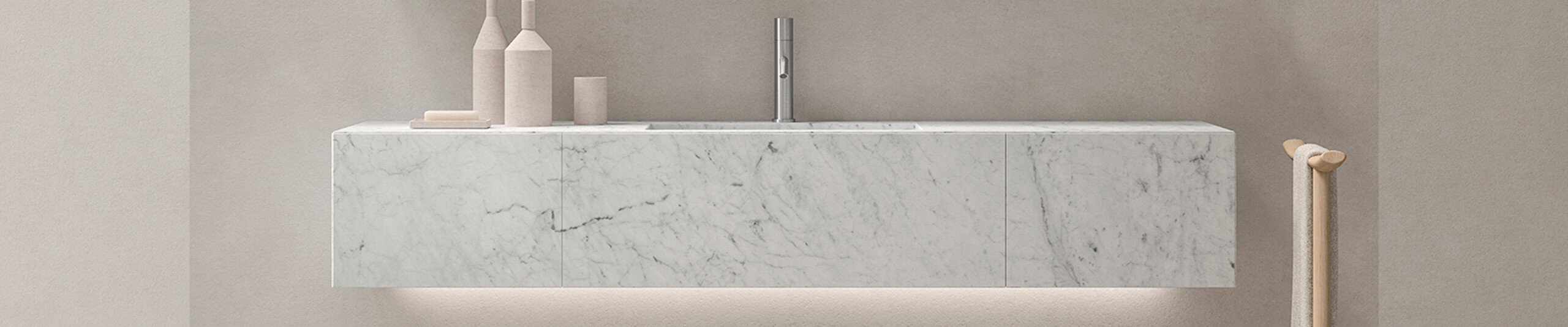 Wall-mounted marble bathroom vanity with integrated sink and metal faucet
