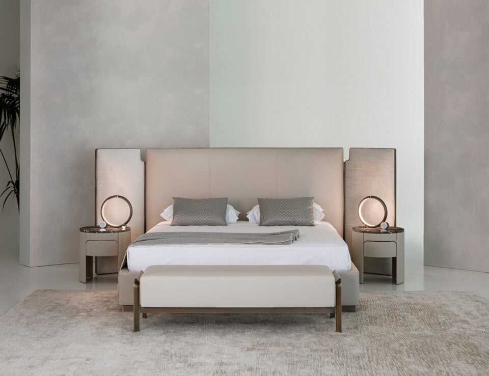 Leather storage bed with tall upholstered headboard in bedroom setting
