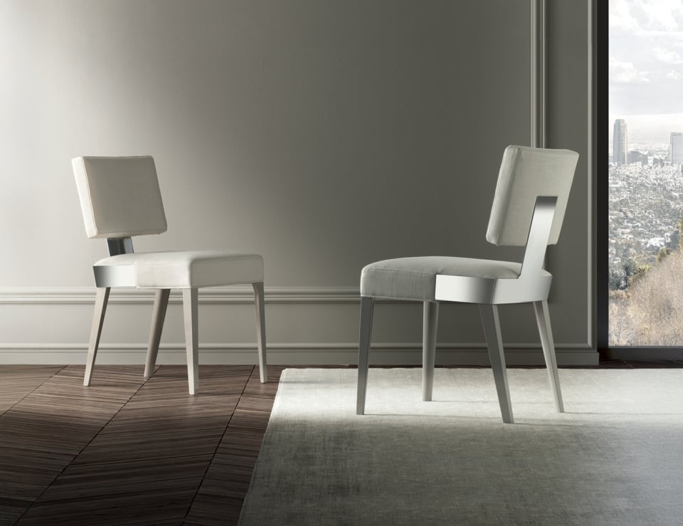 Fabric and wood dining chairs with cushioned seats in a neutral room setting