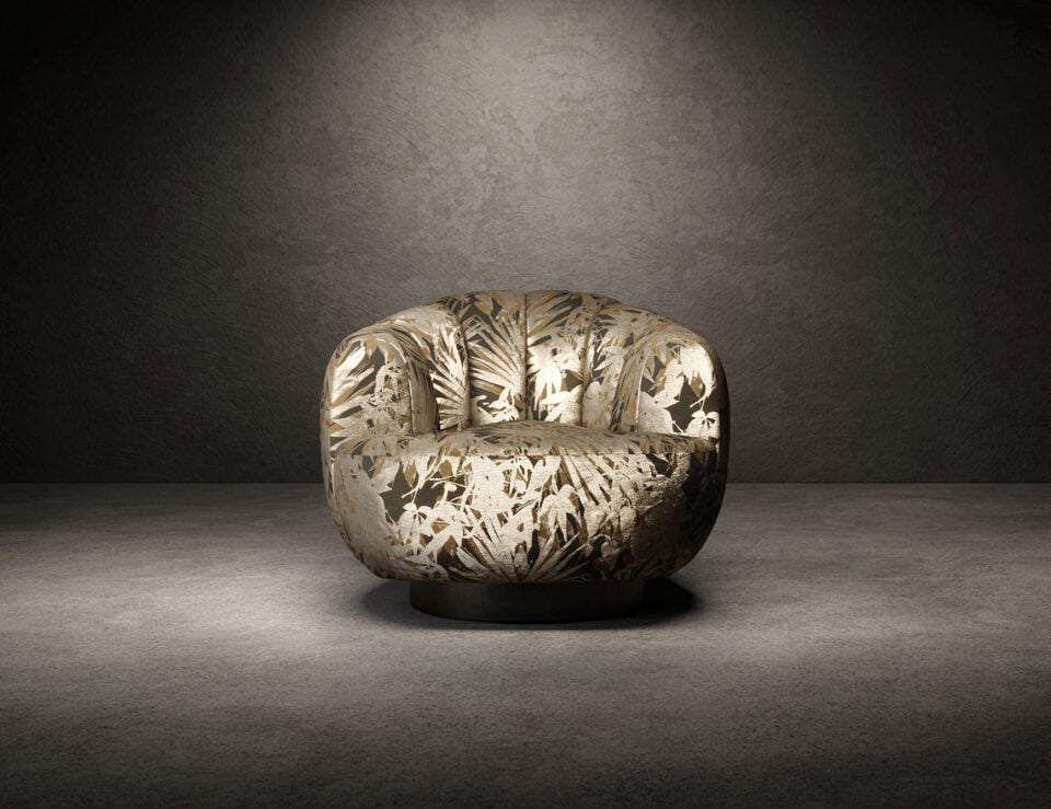 Fabric swivel armchair with patterned upholstery in neutral setting