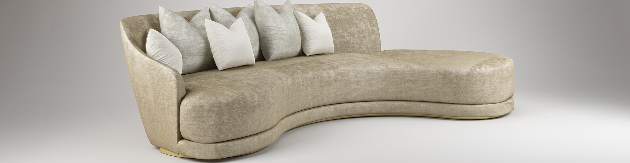 Curved beige fabric sofa with multiple light-colored cushions