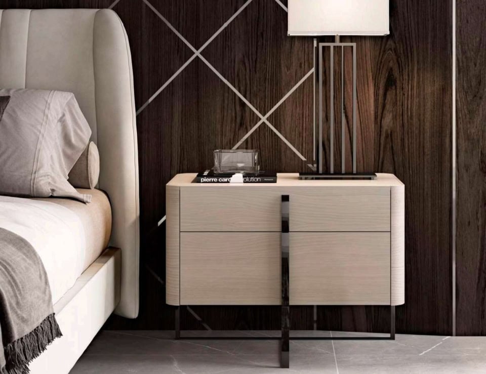 Wood bedside table with cedar finish and metal legs beside bed