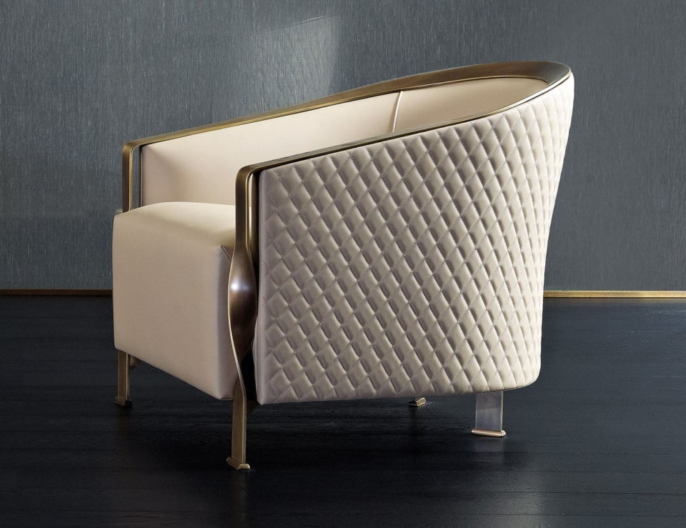 Leather armchair with quilted back and metal frame