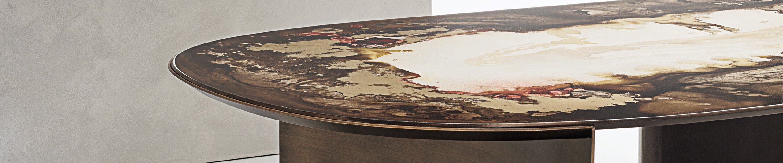 Oval dining table with decorative resin top and metal base