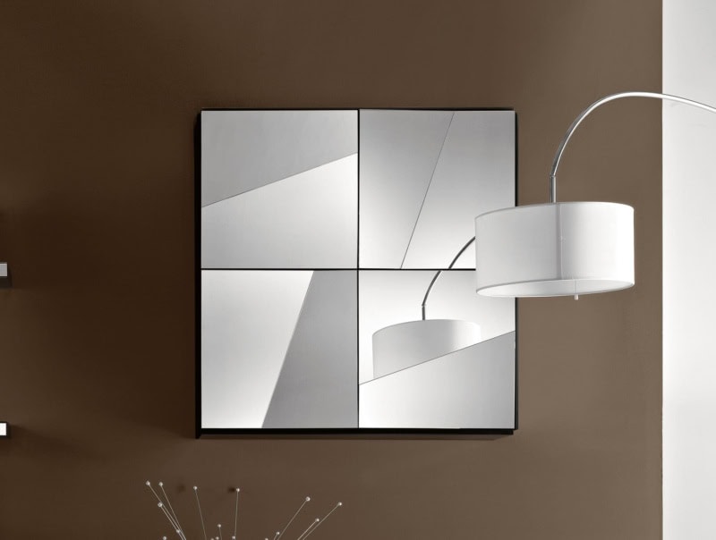 Square wall mirror with four mirrored glass panels and black frame