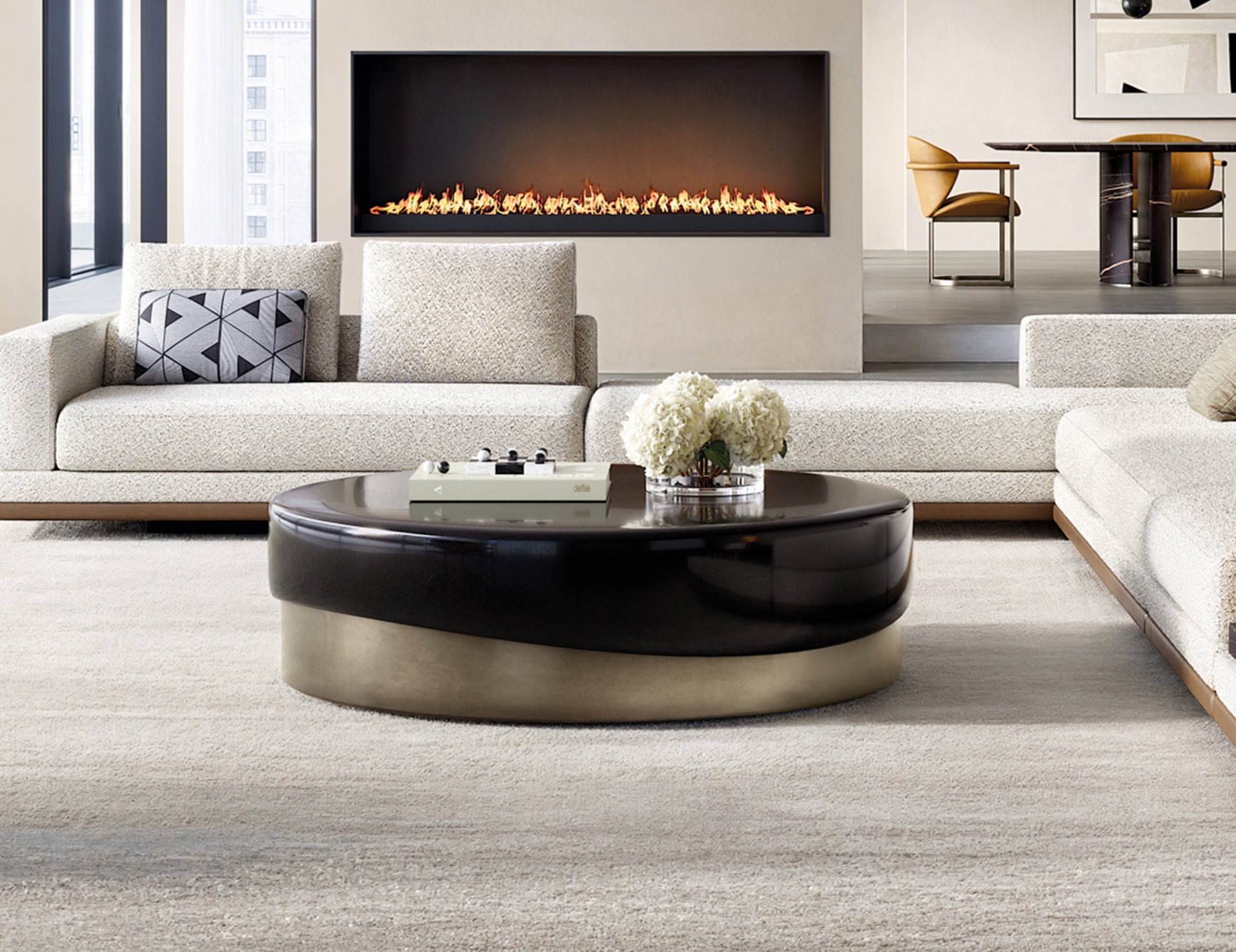 Round lacquered wood coffee table in a living room setting