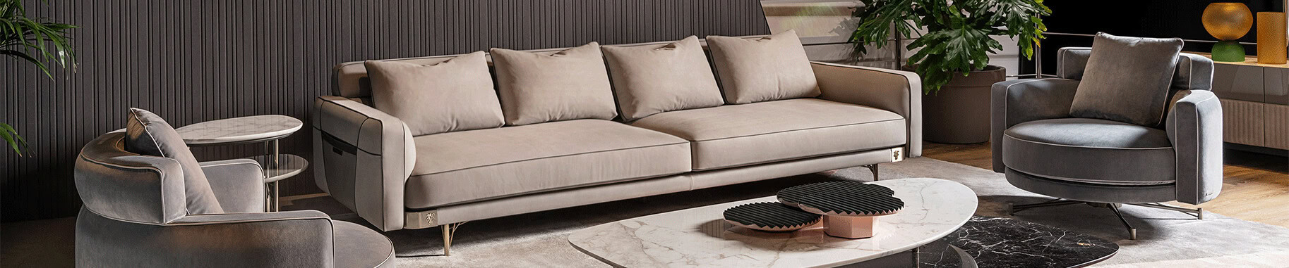 Fabric sofa and armchairs with metal legs next to marble tables
