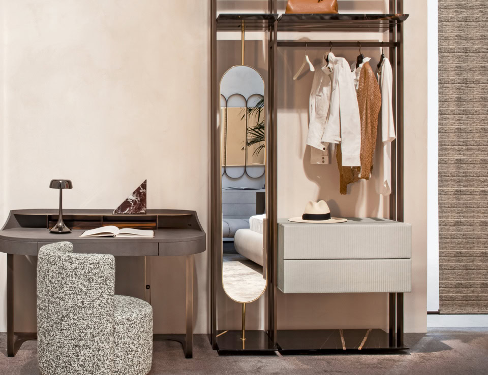 Metal framed wall mirror with integrated storage unit in a home interior